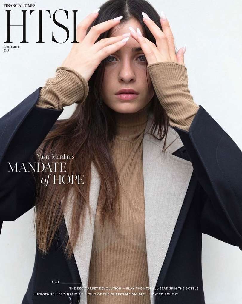 Magazine cover featuring a portrait of Yusra Mardini, with dark hair and a tan turtleneck sweater, in front of a neutral background.