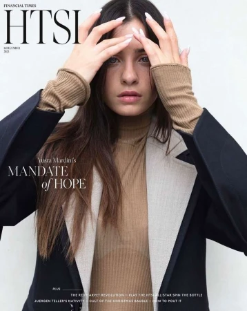 Magazine cover featuring a portrait of Yusra Mardini, with dark hair and a tan turtleneck sweater, in front of a neutral background.