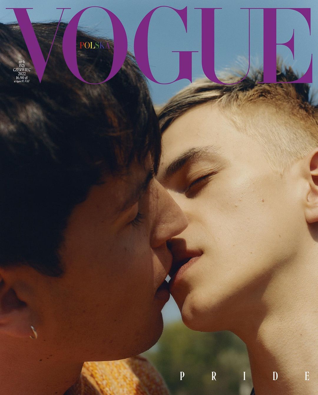 Vogue Polska cover featuring two adult males in a close-up shot, sharing a kiss against a blurred background, with 'Pride' text visible.