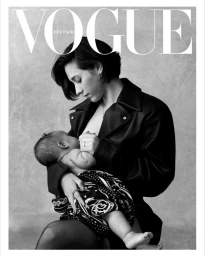 Monochrome magazine cover portrait of a woman holding an infant against a textured grey background by Stefan Heinrichs