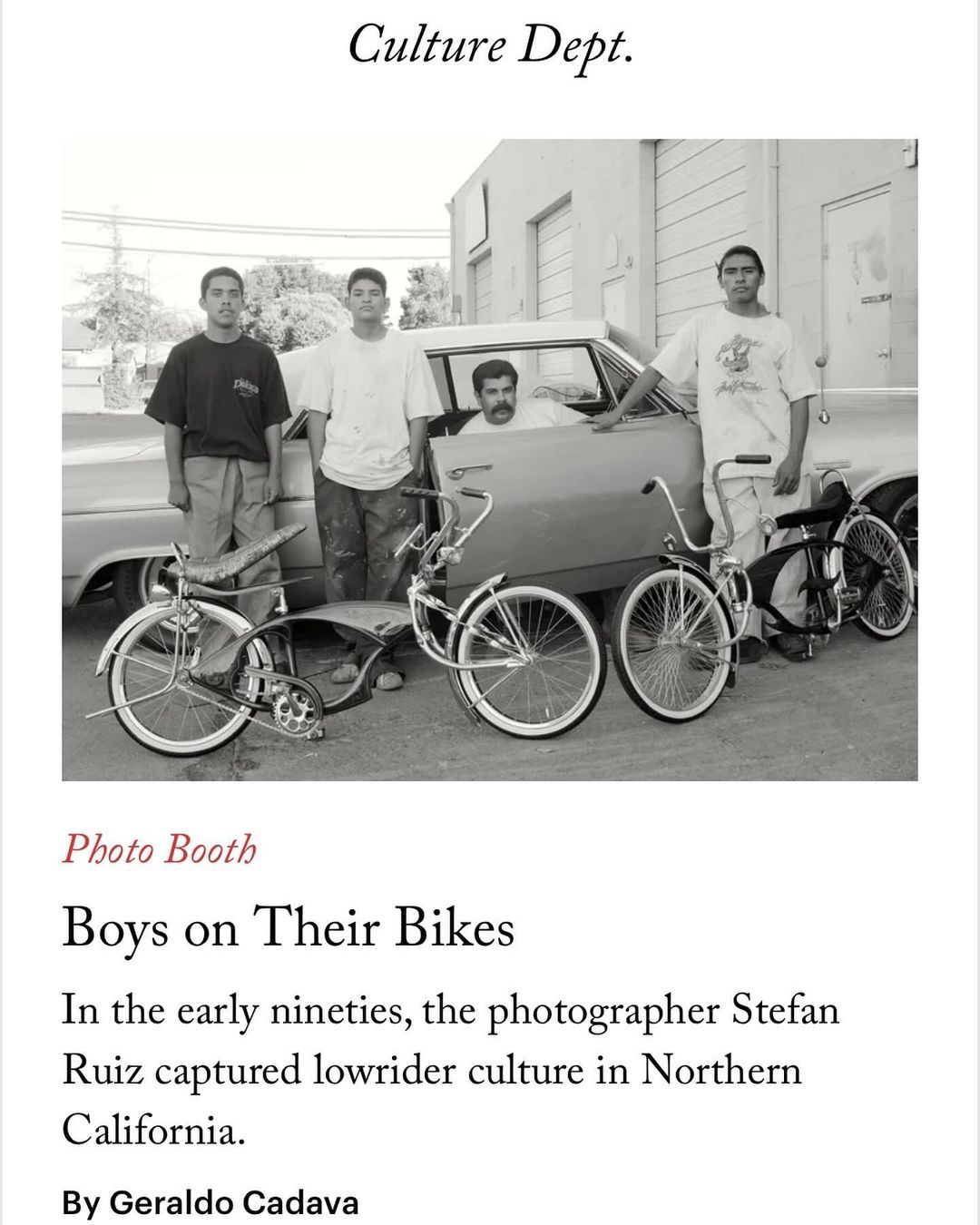 Four young men pose with lowrider bicycles and a vintage car in a black and white outdoor shot, showcasing lowrider culture.