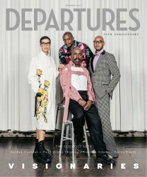 Group portrait of four Black artists and creatives posed against a white pleated curtain backdrop for a magazine cover by Stefan Ruiz