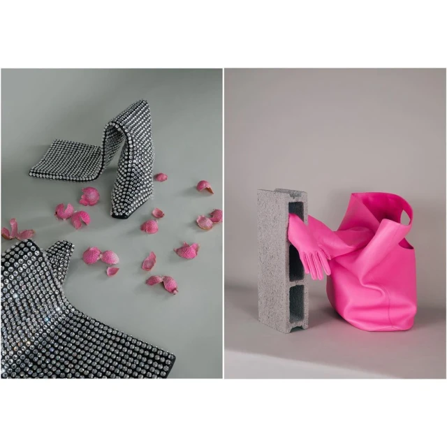 Fashion still life featuring a sparkling, bejeweled high heel shoe and a rubber glove placed between a cinder block and a pink handbag.
