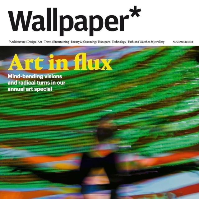 Wallpaper magazine cover featuring an abstract, colorful background and blurred human figure, promoting their annual art special.