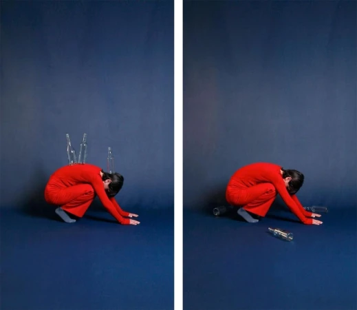 Artistic diptych image shows a woman in red crouching on a blue background, with empty bottles on her back and around her.