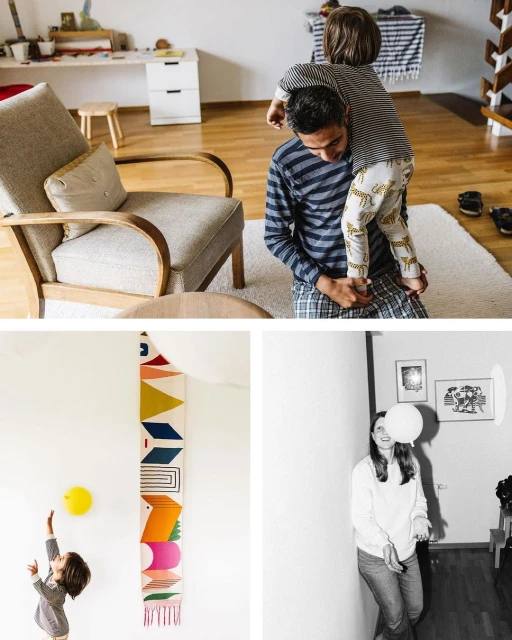 Indoor family scene: father giving a child a piggyback ride, a child playing with a yellow ball, and a woman holding a white balloon.