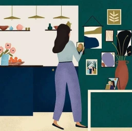 Illustrated woman with dark hair hanging a picture frame on a dark green gallery wall inside a modern home