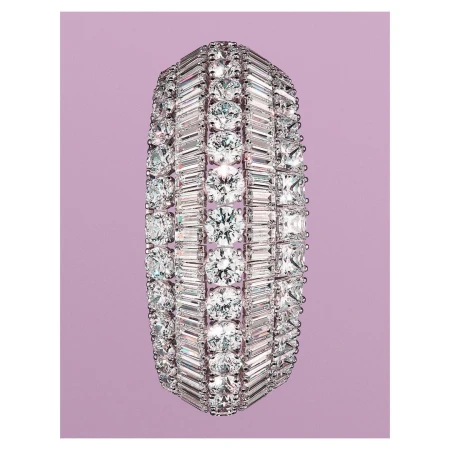 Diamond bracelet featuring round and baguette-cut diamonds in a multi-row setting on a light purple background.