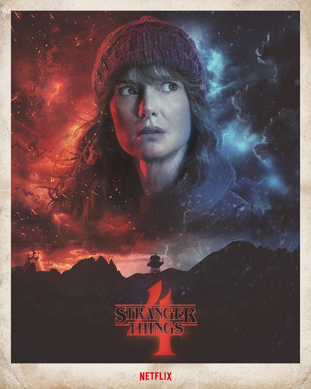 Woman wearing a knitted hat poses in a promotional poster for Stranger Things 4, set against a stormy, mountainous backdrop.