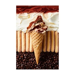 Tiramisu ice cream cone centered over rows of ladyfingers, coffee beans, cream, and dusted cocoa powder.
