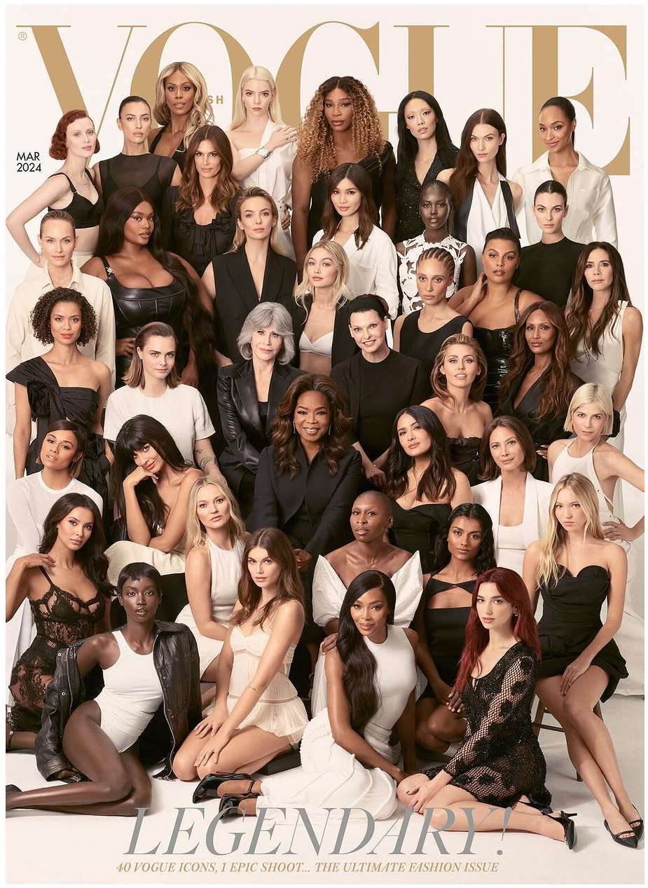 Magazine cover featuring a group of diverse female models, including Oprah, wearing various black and neutral-toned outfits in a photo studio.