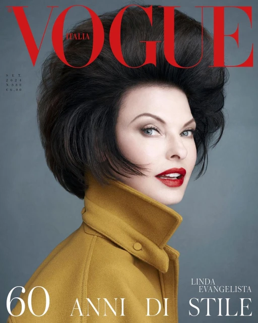 Fashion magazine cover featuring Linda Evangelista with dark hair and red lips, wearing a yellow coat, against a gray background. Vogue Italia.