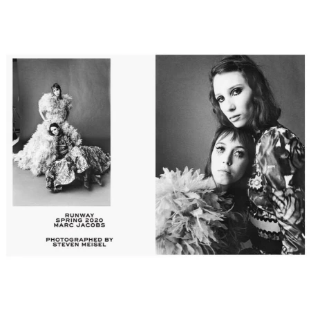 Black and white fashion editorial featuring two women modeling haute couture garments against a neutral studio backdrop, retro-inspired styling.