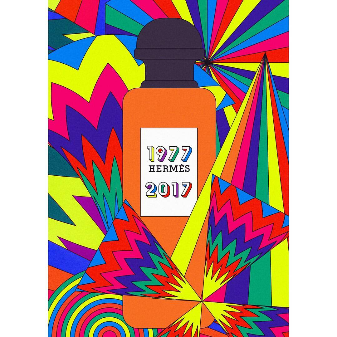 Orange perfume bottle with black cap and colorful geometric background in pop art style with '1977 Hermès 2017' on label.