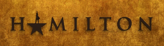 Text graphic reading Hamilton in dark serif letters against a textured metallic gold background with a star replacing the letter A.