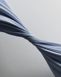 Twisted length of pale blue fabric stretching diagonally across a smooth gradient background.