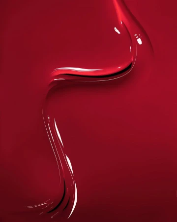 Abstract close-up of shiny, textured red fluid, possibly nail polish or paint, featuring glossy highlights and dark shadows.
