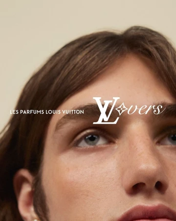 Close-up portrait of a young man with brown hair and light eyes, featuring overlaid white Louis Vuitton advertising text.