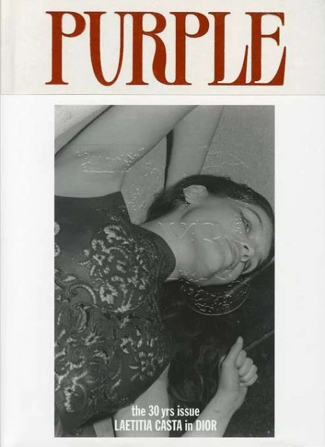 Black and white magazine cover featuring Laetitia Casta in Dior, bathed in soft light, with the masthead 'PURPLE' in red at the top.