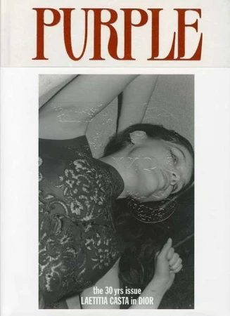 Black and white magazine cover featuring Laetitia Casta in Dior, bathed in soft light, with the masthead 'PURPLE' in red at the top.
