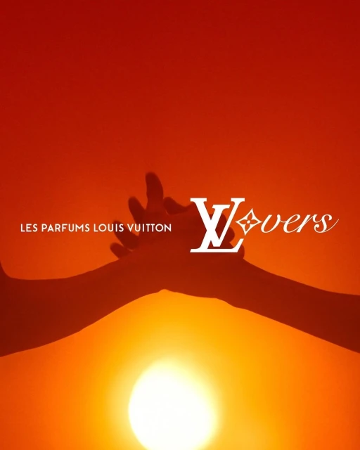 Louis Vuitton Lovers perfume advertisement featuring two hands reaching towards the sun, set against a warm orange background.