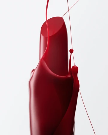 Close-up of red lipstick with dripping red liquid, showcasing beauty and cosmetics in a clean, vibrant product shot against a white background.