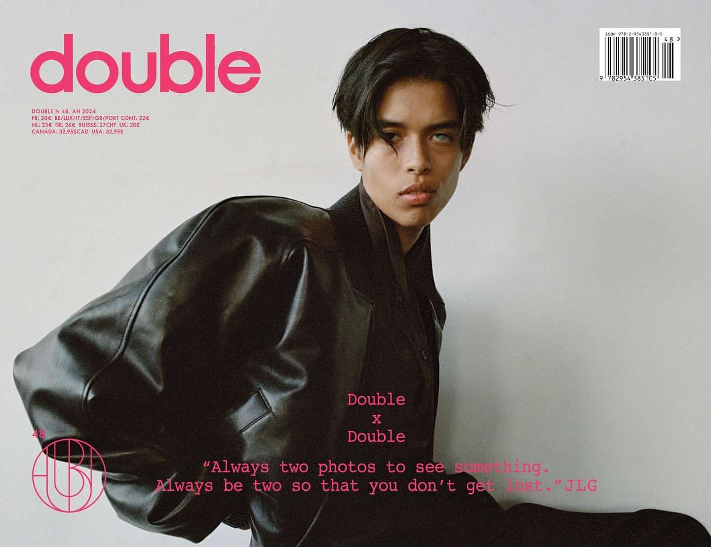 Magazine cover featuring a person in a black jacket against a light background with pink 'double' masthead, and text details.