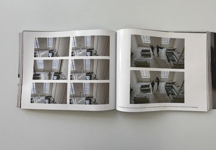 Open magazine pages featuring interior photography with figures in an open-plan architectural space and multiple tiled inset images.