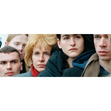 Close-up portrait of a group of people packed closely together, shot by Tanya and Zhenya Posternak in London.