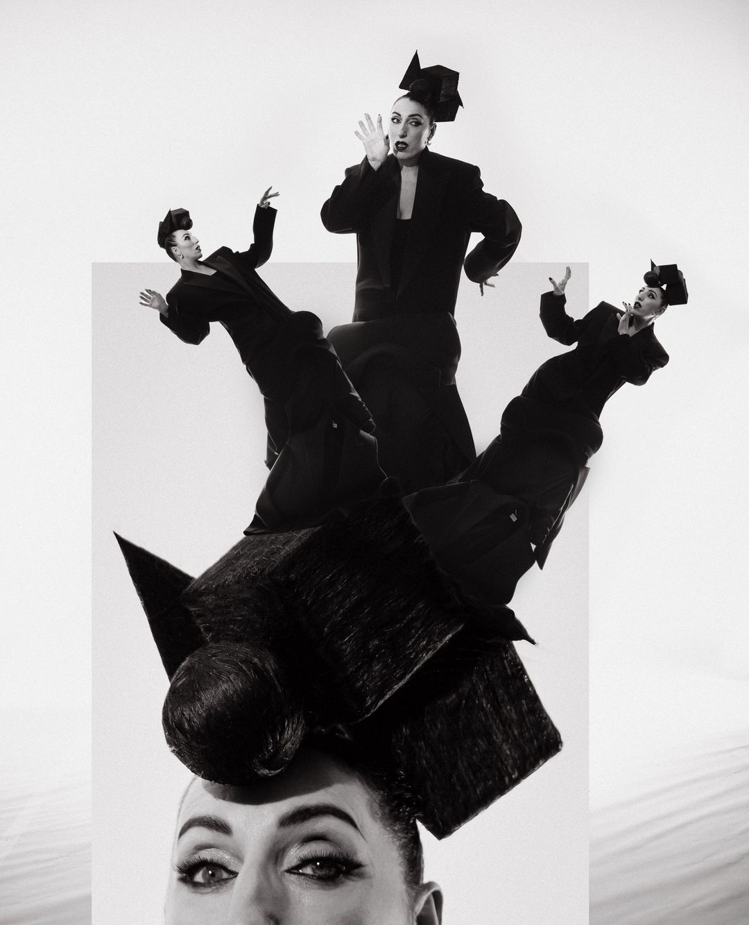 Black and white art photography features woman with elaborate headpiece and multiple full-body reflections against a stark white background.