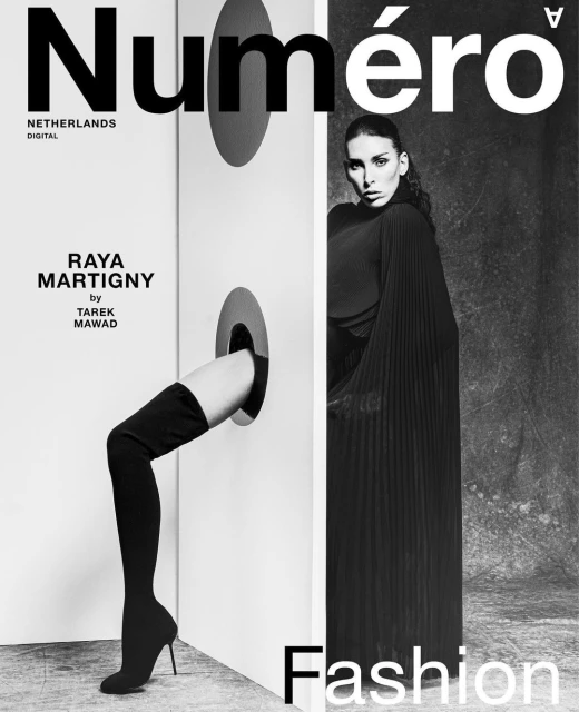Black and white fashion magazine cover with woman in dress and a leg sticking through a hole, text reads 'Numero Netherlands Digital'.