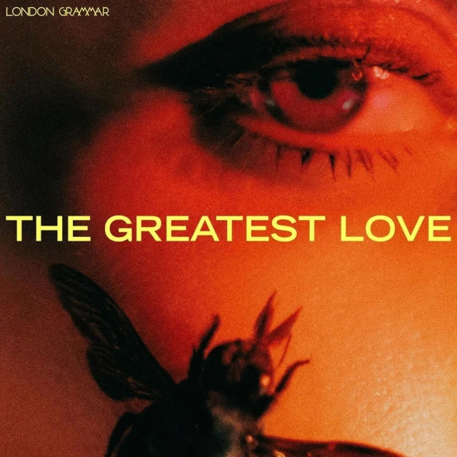 Close up of a person's face, eye, and an insect, with the text 'The Greatest Love' by London Grammar, in a warm, orange color palette.