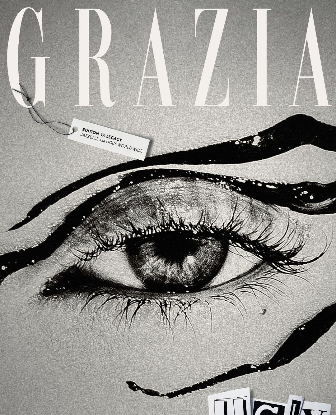 Grazia magazine cover with a close-up of a human eye, bold typography, and a tag with 'Edition 17 Legacy' written on it.