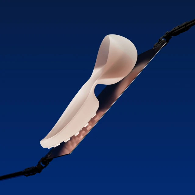 Abstract product shot of white shoe insert on a metal blade, angled against a dark blue background, showcasing design and product details.