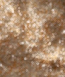 Abstract 3D rendered bokeh light texture in warm golden tones with soft out of focus ring patterns.