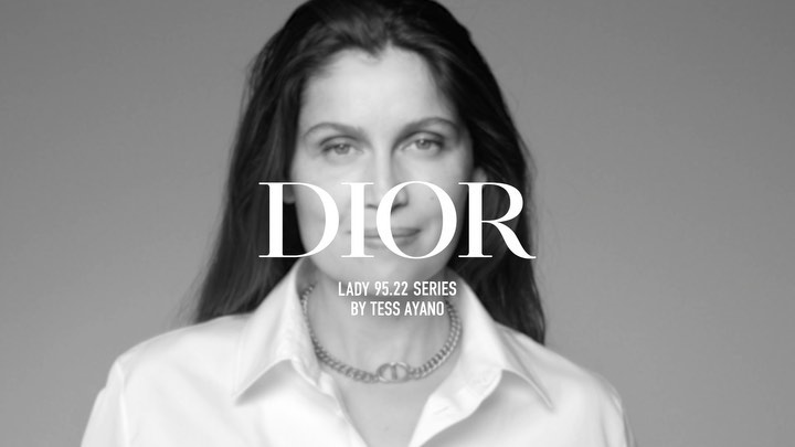 Black and white portrait of an adult woman wearing a collared shirt and necklace, overlaid with the text "DIOR LADY 95.22 SERIES."