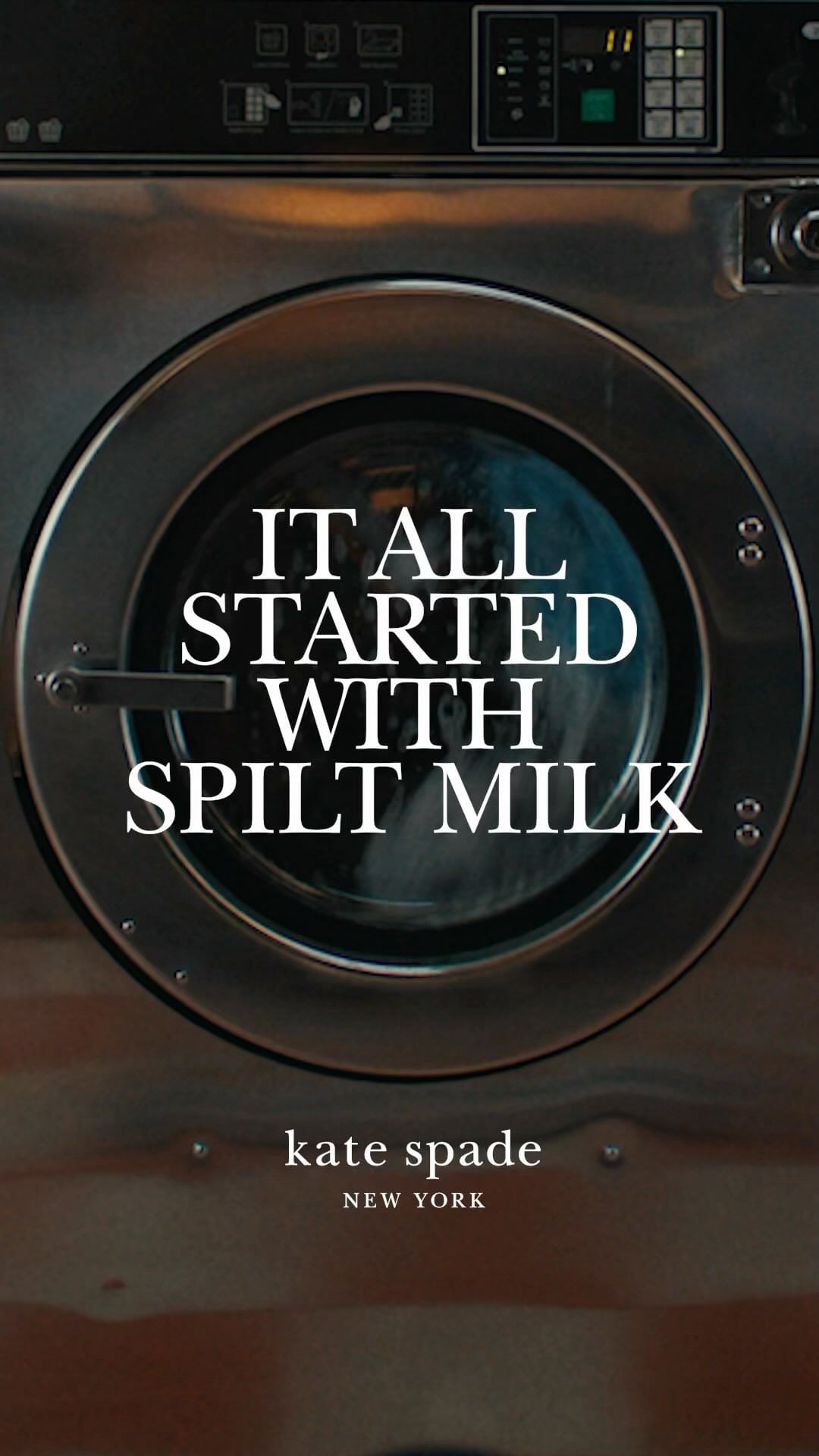 Washing machine with a stainless steel finish features an advertisement with white text, centered around the phrase 'Spilt Milk'.