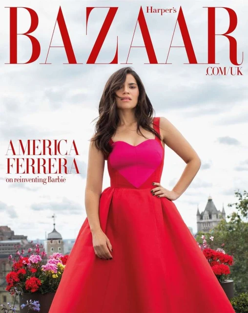 Magazine cover featuring America Ferrera in a red gown posing outdoors with a cityscape backdrop and floral accents. Harper's Bazaar masthead.