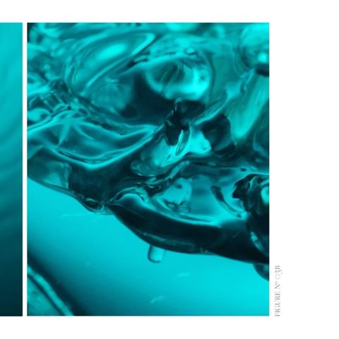 A close-up shot of aquamarine water with distinct surface ripples and waves, creating a visually dynamic and textured abstract.