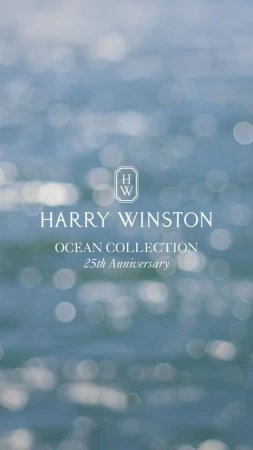 Harry Winston Ocean Collection 25th Anniversary ad featuring a blurred blue ocean background with bokeh effect and logo and text.