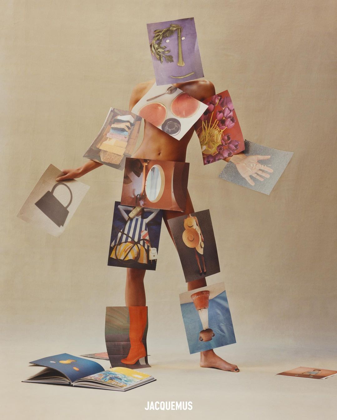 Creative fashion photograph of a person formed of magazine images and collages, posed in a studio with bright lighting and a tan background.