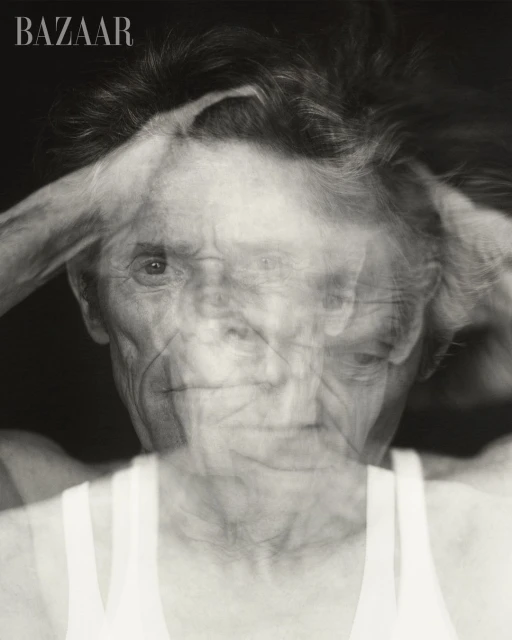 Monochromatic portrait featuring an elderly person with short hair against a dark background. The image shows multiple exposures.