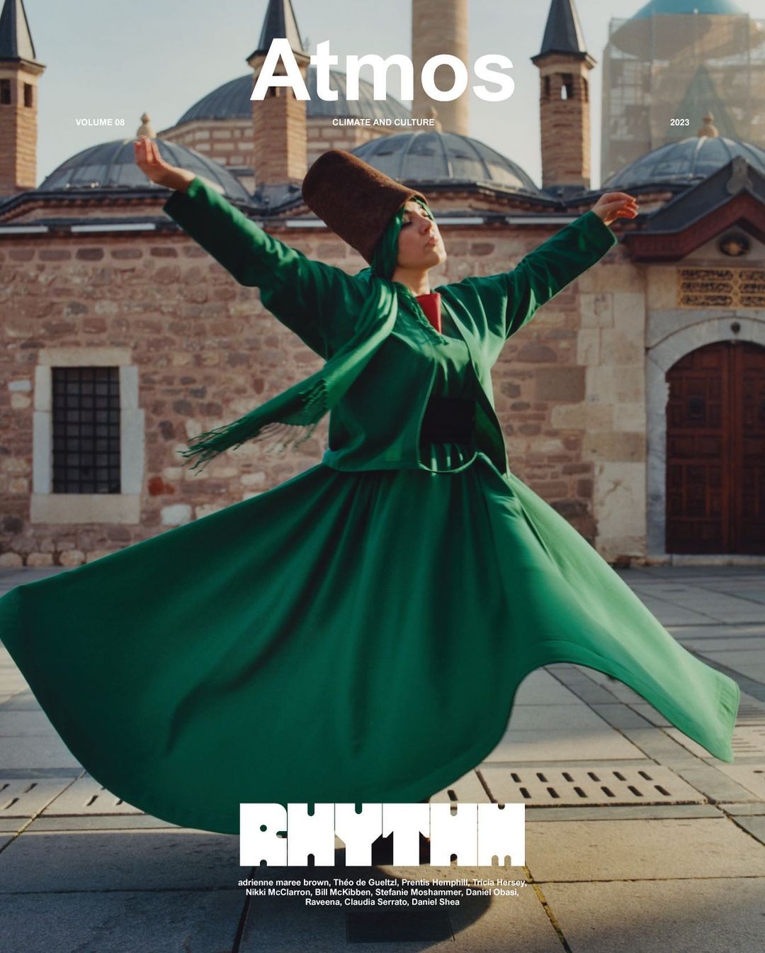 Magazine cover featuring a whirling dervish in a green robe in a stone building exterior with Atmos and Rhythm text overlays.