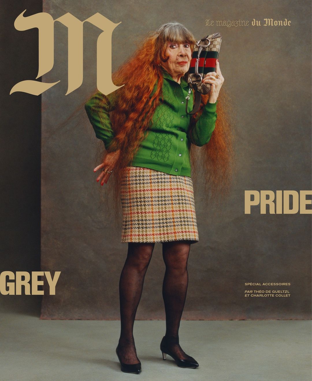 Magazine cover shot: An elderly woman with long, auburn hair poses in a green sweater and plaid skirt, holding a Gucci clutch.