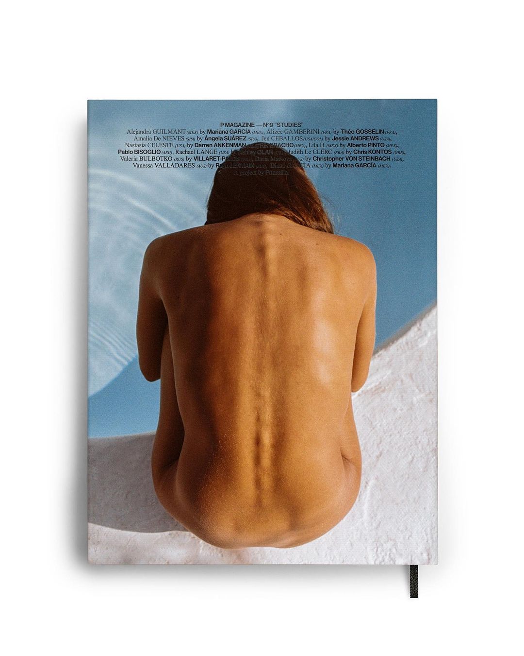 Back view of a woman with wet hair sitting on a white surface by a pool on the cover of 'P Magazine' and 'Sky Studies'.