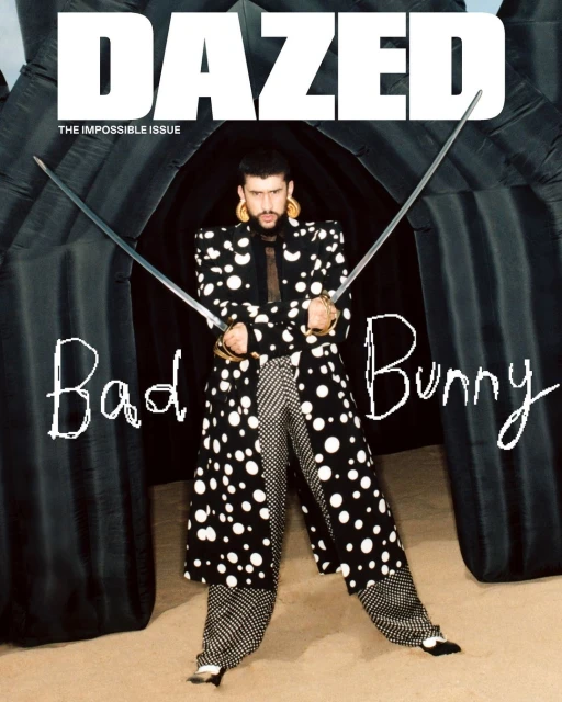 Bad Bunny poses on Dazed magazine cover in a polka dot suit, holding swords, in front of an inflatable background. Magazine cover.