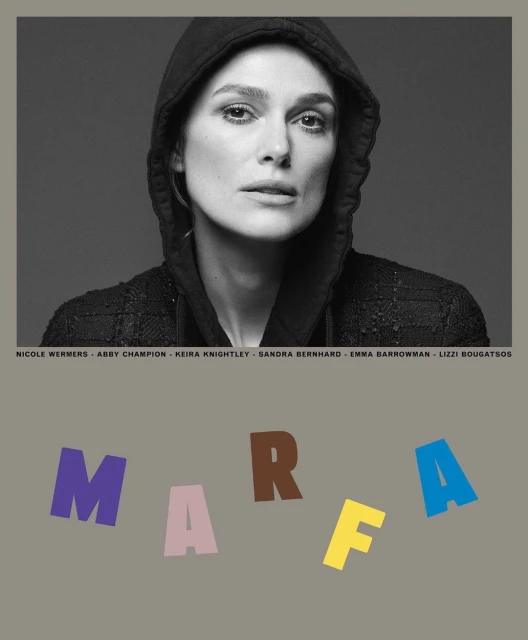 Monochrome portrait of Keira Knightley wearing a hooded jacket, set against a grey backdrop with a floating multicoloured text graphic.