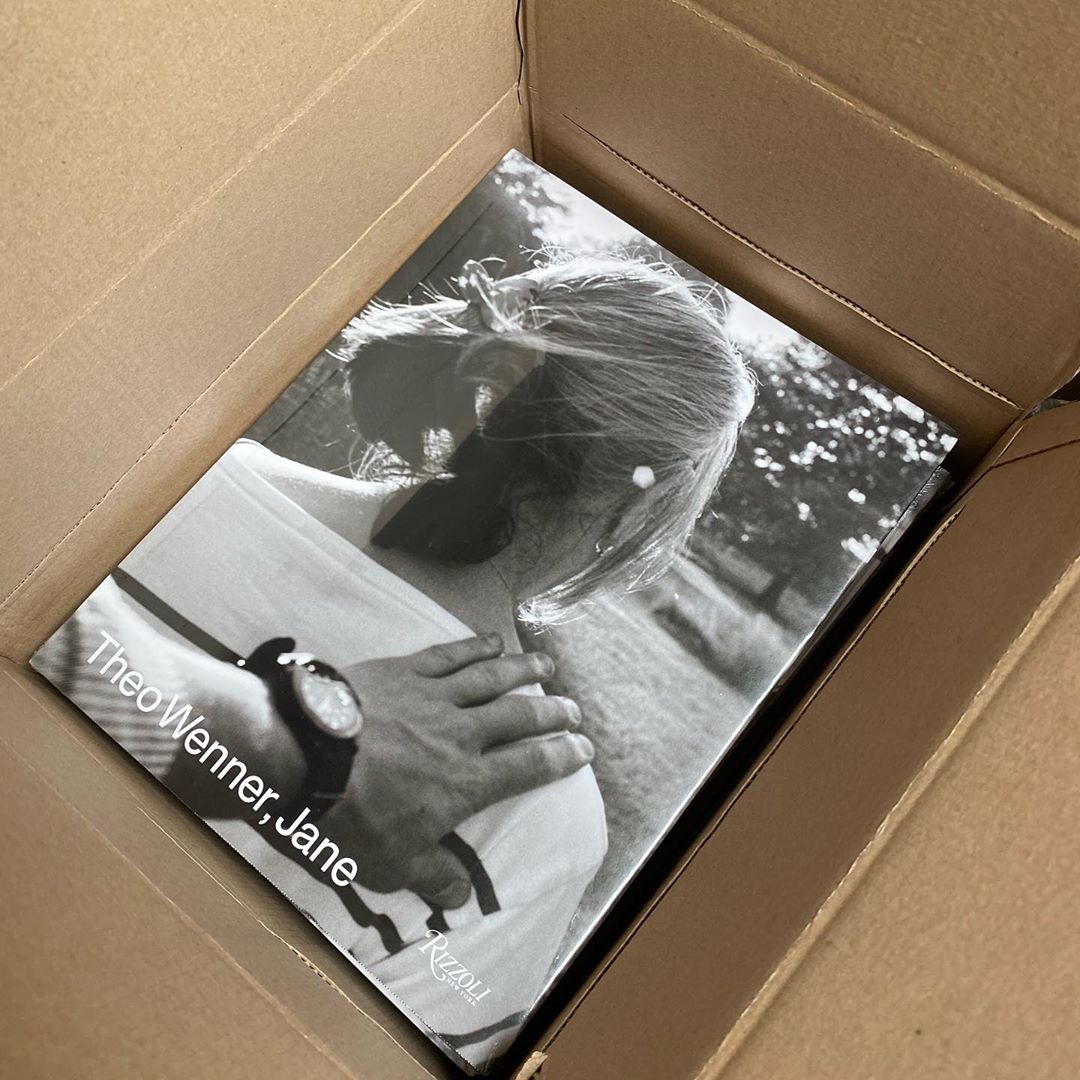 Black and white photo book inside a cardboard box, featuring a portrait of a woman and the text 'Theo Wenner, Jane' on the cover.