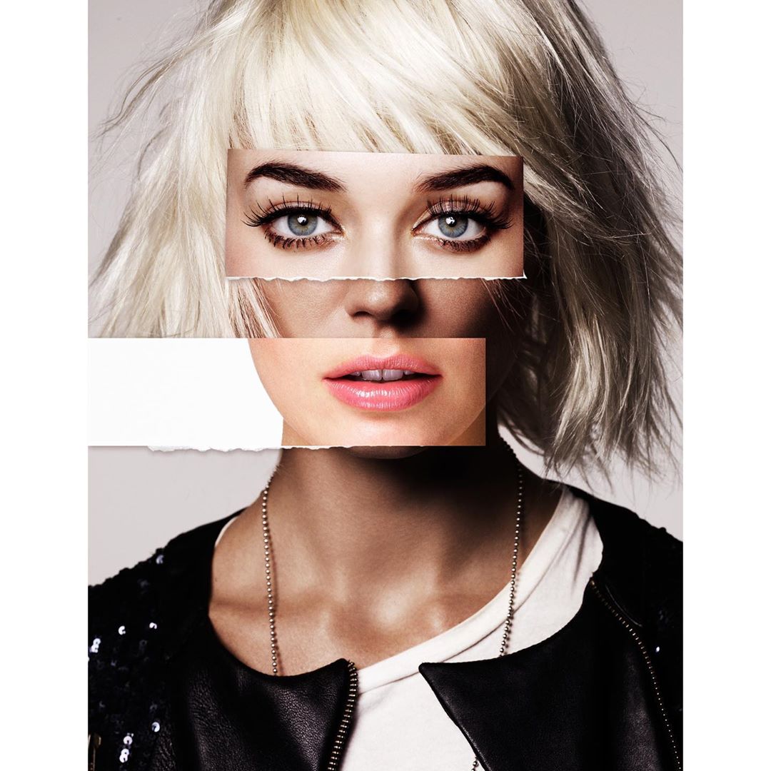 Portrait of a blonde woman with a collaged face overlay, wearing a black jacket and white t-shirt against a grey background.