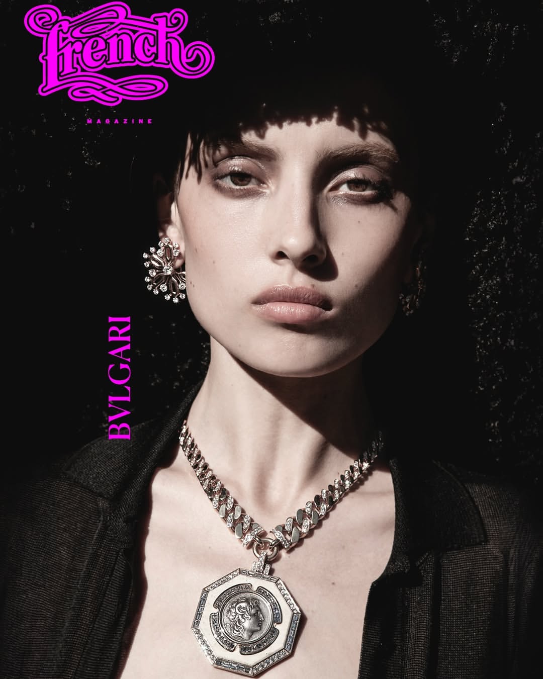 Editorial portrait of a woman with dark hair and a statement necklace, featuring the French Magazine logo and Bulgari branding against a dark background.